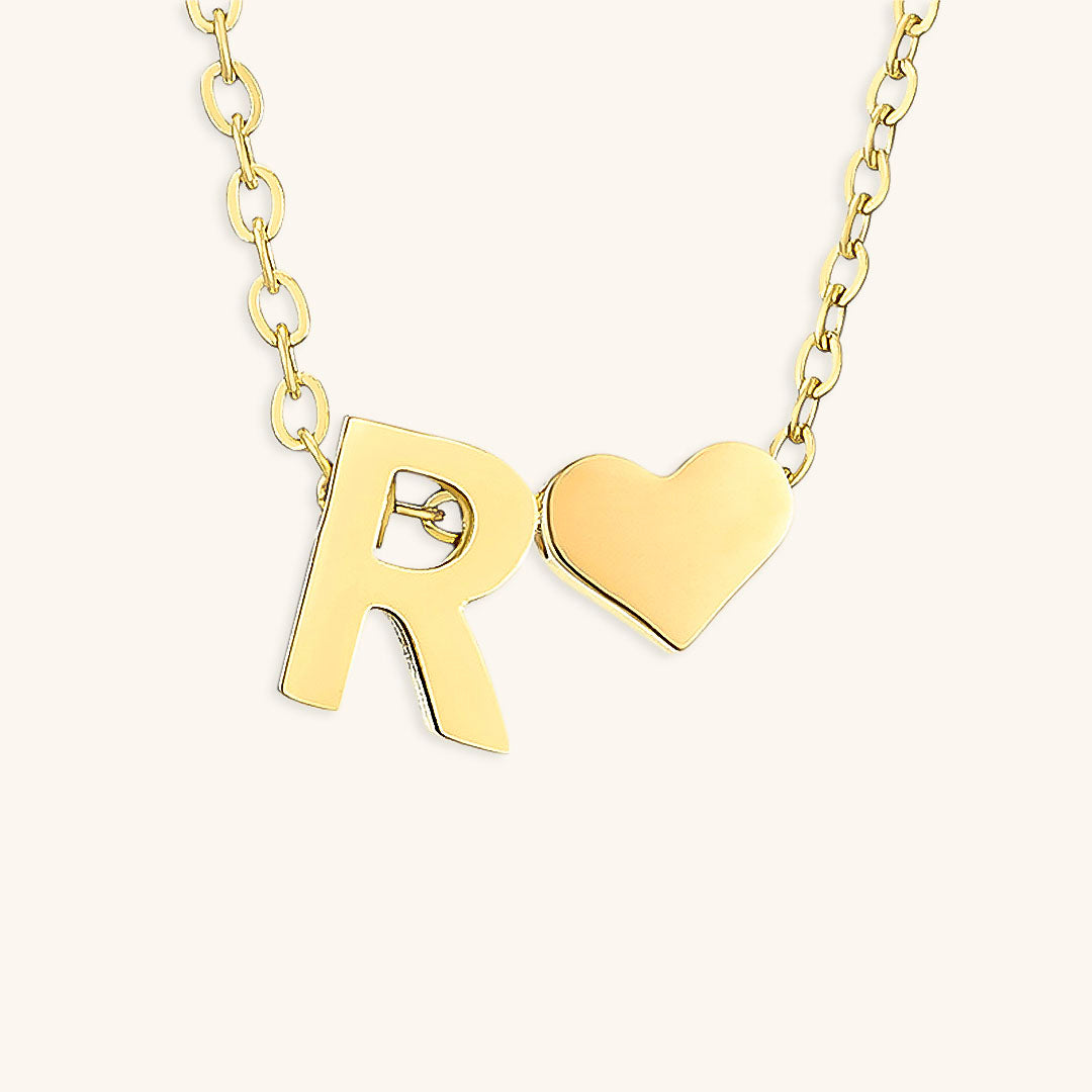 Goldkette mit Anfangsbuchstaben „Ria“